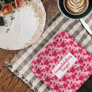 Maple lekt op een roze Bord met achtergrondpapier