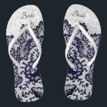Marine Blauw Bloemen Kant en Witte Glitter Teenslippers<br><div class="desc">Prachtig uitziende Flip Flop Schoenen met faux navy blauw bloemenkant op een faux witte glitter achtergrond klaar voor u om te personaliseren met jouw naam of bruids feesttitels. ✔ OPMERKING: WIJZIG ALLEEN DE BENODIGDE SJABLOON GEBIEDEN! 😀 Indien nodig, kunt u de tekst verwijderen en beginnen met het opnieuw toevoegen van...</div>