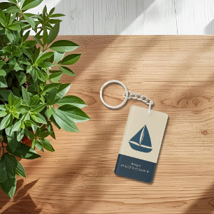 marineblauwe zeilboot met naam en coördinaten sleutelhanger