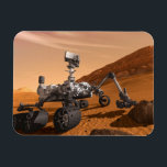 Mars Science Laboratory Curiosity Rover. Magneet<br><div class="desc">Het concept van Mars Science Laboratory Curiosity rover is een mobiele robot die het cadeau van Mars onderzoekt. In dit afbeelding onderzoekt de rover een rots op Mars met een set gereedschappen aan het uiteinde van de arm van de rover, die ongeveer 7 voet uitstrekt. Twee instrumenten op de arm...</div>