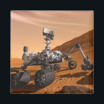 Mars Science Laboratory Curiosity Rover. Magneet<br><div class="desc">Het concept van Mars Science Laboratory Curiosity rover is een mobiele robot die het cadeau van Mars onderzoekt. In dit afbeelding onderzoekt de rover een rots op Mars met een set gereedschappen aan het uiteinde van de arm van de rover, die ongeveer 7 voet uitstrekt. Twee instrumenten op de arm...</div>