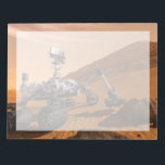 Mars Science Laboratory Curiosity Rover. Notitieblok<br><div class="desc">Het concept van Mars Science Laboratory Curiosity rover is een mobiele robot die het cadeau van Mars onderzoekt. In dit afbeelding onderzoekt de rover een rots op Mars met een set gereedschappen aan het uiteinde van de arm van de rover, die ongeveer 7 voet uitstrekt. Twee instrumenten op de arm...</div>