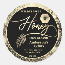 Matig aantrekkelijke honing met een gouden bijenka ronde sticker