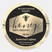 Matig aantrekkelijke honing met een gouden bijenka ronde sticker (Voorkant)