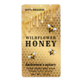 Matig druppelt gouden bijenhoningpot op etiket (Voorkant)