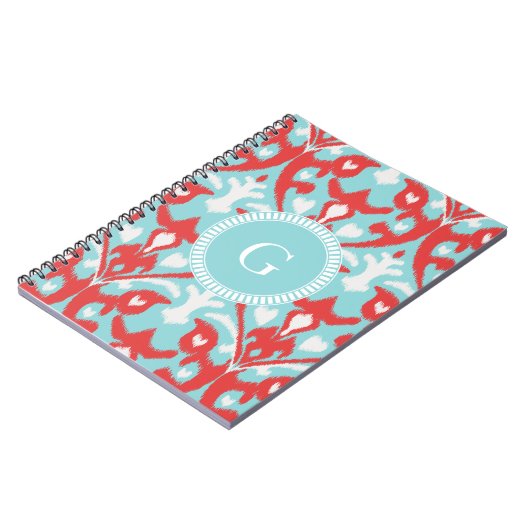 Matig monogram van het rode ikattribaal notitieboek (Linkerzijde)