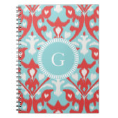 Matig monogram van het rode ikattribaal notitieboek (Voorkant)