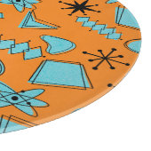 MCM Atomic Shapes Turquoise op Sinaasappel Snijplank (Hoek)