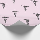 Medische kaducus op roze cadeaupapier (Hoek)