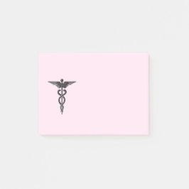 Medische kaducus op roze post-it® notes
