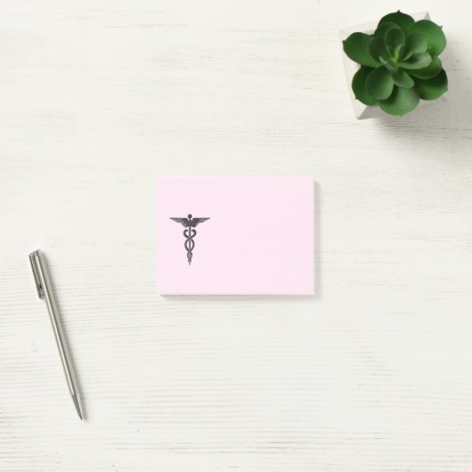 Medische kaducus op roze post-it® notes (Kantoor)