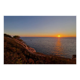Mediterranean sunset with a boat perfect poster