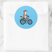Meerkat op de fiets ronde sticker (Tas)