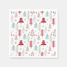 Meerkleurige kerstbomen op een wit servet