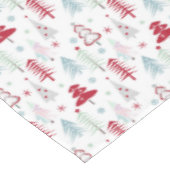 Meerkleurige kerstbomen op een wit tafelkleed (Gekanteld)