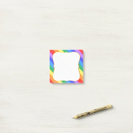 Meerkleurige regenboogkleuren post-it® notes (Op bureau)