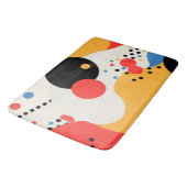 Meerkleurige stippen op een gebroken witte achterg badmat (Gekanteld)