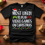 Meest waarschijnlijk om VIDEOGAMES TE SPELEN OP KE T-shirt<br><div class="desc">Grappige volwassen bijpassende familie T-shirts. Draag met Kerstmis, Kerstfeest, of geef als cadeau. Unisex T-shirt. Hoogwaardige t - shirts worden geleverd in uw keuze van verschillende "Most Likely To"-gezegden. De meeste kans om kerstfilms C te kijken - de meeste kans om alle koekjes D te eten - de meeste kans...</div>