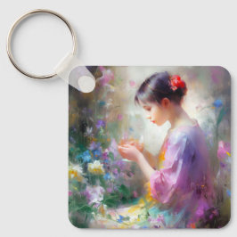 Meisje bewondering van een bloem in haar handen sleutelhanger