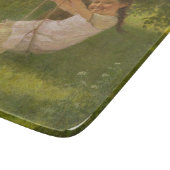 Meisje glimlachen op een zwaai ( kindertijd) snijplank (Hoek)