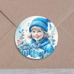 meisje in blauw met geschenkdoos en bloemen ronde sticker<br><div class="desc">Schattig klein  meisje in blauw met een geschenkdoos sneeuw en bloemige achtergrond. Voeg een zoete retro of nostalgische sfeer toe aan je kerstkaarten of feesttassen!</div>