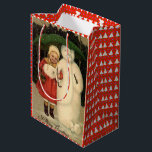 Meisje in de rode jas met Snowman, witte kerst Medium Cadeauzakje<br><div class="desc">Kerstcadeautas -  afbeelding van een klein meisje in een rode jas die een lachende sneeuwman beschermt met een groene paraplu.</div>