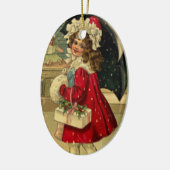 Meisje met kerstcadeau keramisch ornament (Links)