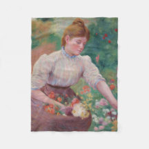 Meisje plukken bloemen in een zomertuin