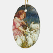 Meisje voert konijnen keramisch ornament (Links)