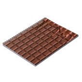 Melade chocolade die over een chocoladeblok druppe notitieboek (Linkerzijde)