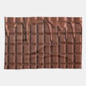 Melade chocolade die over een chocoladeblok druppe theedoek (Horizontaal)