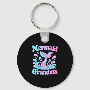 Mens speelse zeemeerminstaart met waterspatten sleutelhanger