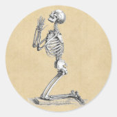 Menselijke skeletanatomie in gebeden ronde sticker (Voorkant)