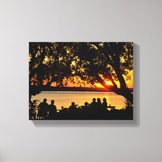 Mensen aan de rand van de rivier bij zonsondergang canvas afdruk (Voorkant)