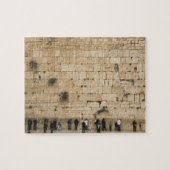 Mensen bidden aan de wand legpuzzel (Horizontaal)