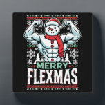 Merry Flexmas - Snowman Flexing Christmas Gym Fotoplaat<br><div class="desc">Omarm de feestelijke geest en sportschool met dit hilarische "Merry Flexmas" -ontwerp! Met een gescheurde sneeuwman met uitpuilende biceps, omringd door feestelijke elementen zoals sneeuwvlokken, kerstbomen en vakantiepatronen, is dit ontwerp perfect voor iedereen die weigert zijn training over te slaan, zelfs tijdens de feestdagen. Of je nu een fitnessliefhebber, bodybuilder...</div>