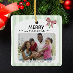 Merry Memories Photo Christmas Bow Ornament<br><div class="desc">Dit ornament met kerstbomen biedt ruimte voor 2 foto's die zijn ingelijst in een zacht, lichtgroen gestreept kader aan de voorkant en een rijk rood aan de achterkant. Bovenaan wordt de uitdrukking "MERRY memories" prominent weergegeven, waarbij een vet, feestelijk lettertype wordt gecombineerd met een elegant script. Een rode en groene...</div>