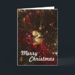 Merry Snowman Christmas Kaart<br><div class="desc">Een vrolijke sneeuwman die aan een kerstboom hangt.</div>