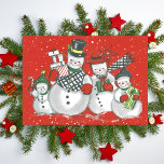 Merry Snowman Familie Custom Christmas Feestdagenkaart<br><div class="desc">Verspreid feestvreugde met deze vintage kerstkaart met een schattig sneeuwgezin dat in de vakantiewinter is uitgedost en cadeaus draag. Personaliseer door het bericht aan de achterkant aan te passen en/of jouw namen toe te voegen of de tekstvakken leeg te laten als u liever handgeschreven berichten toevoegt voordat u deze aflevert....</div>