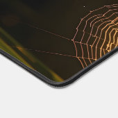 Met dauw bedekt spinnenweb bij zonsopgang bureaumat (Hoek)