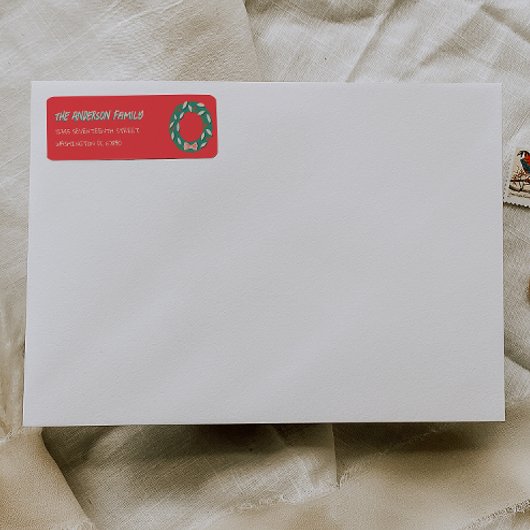 Met de hand geschilderde rode groene kerstkrans ad etiket