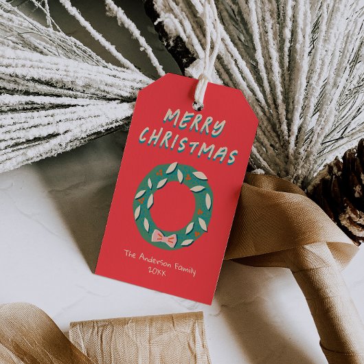 Met de hand geschilderde rode groene kerstkrans ve cadeaulabel