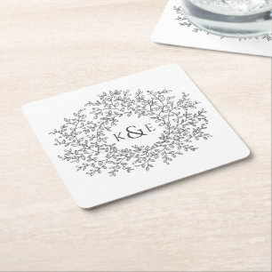 Met de hand getekende cirkel van bladeren monogram kartonnen onderzetters