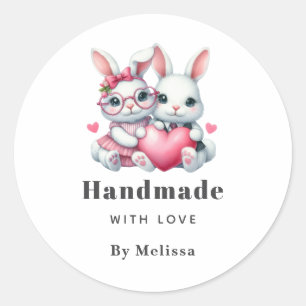 Met de Hand van Liefde Moppige Konijnen Delen een Ronde Sticker