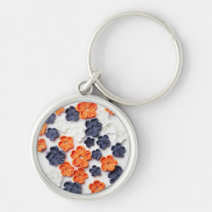 Met de lente vervaardigde plantenslijmen oranje bl sleutelhanger