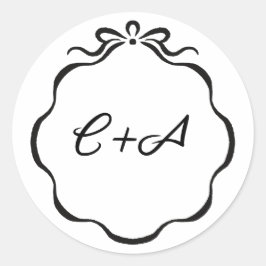 Met inkt geschreven linten en strik beginletters t ronde sticker