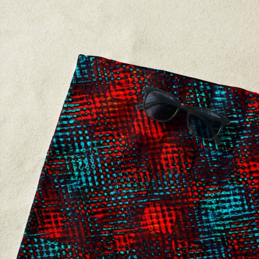 Met vierkant ingekrabd rood en helder blauw strandlaken (In situ)