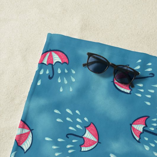 Meteorologische vun regenachtig weer en paraplu's strandlaken (In situ)