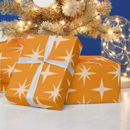 Midden eeuw atomaire stervuurwerkpatroon op oranje cadeaupapier