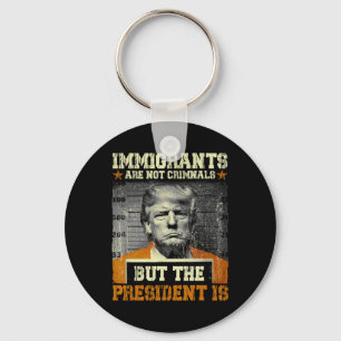 Migranten zijn geen criminelen maar de president i sleutelhanger